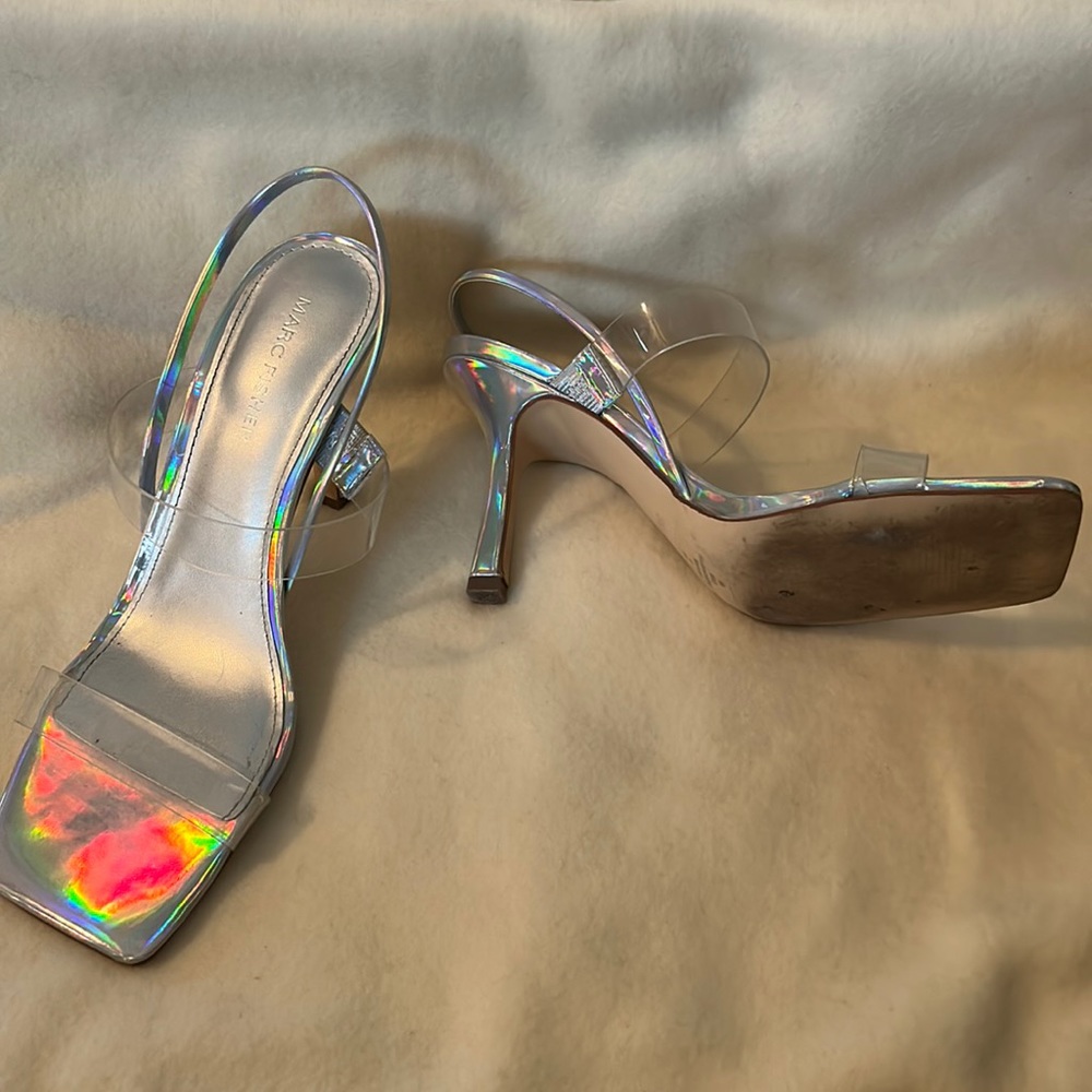 Silver shoe with two clear strap across the foot. Nice shoe